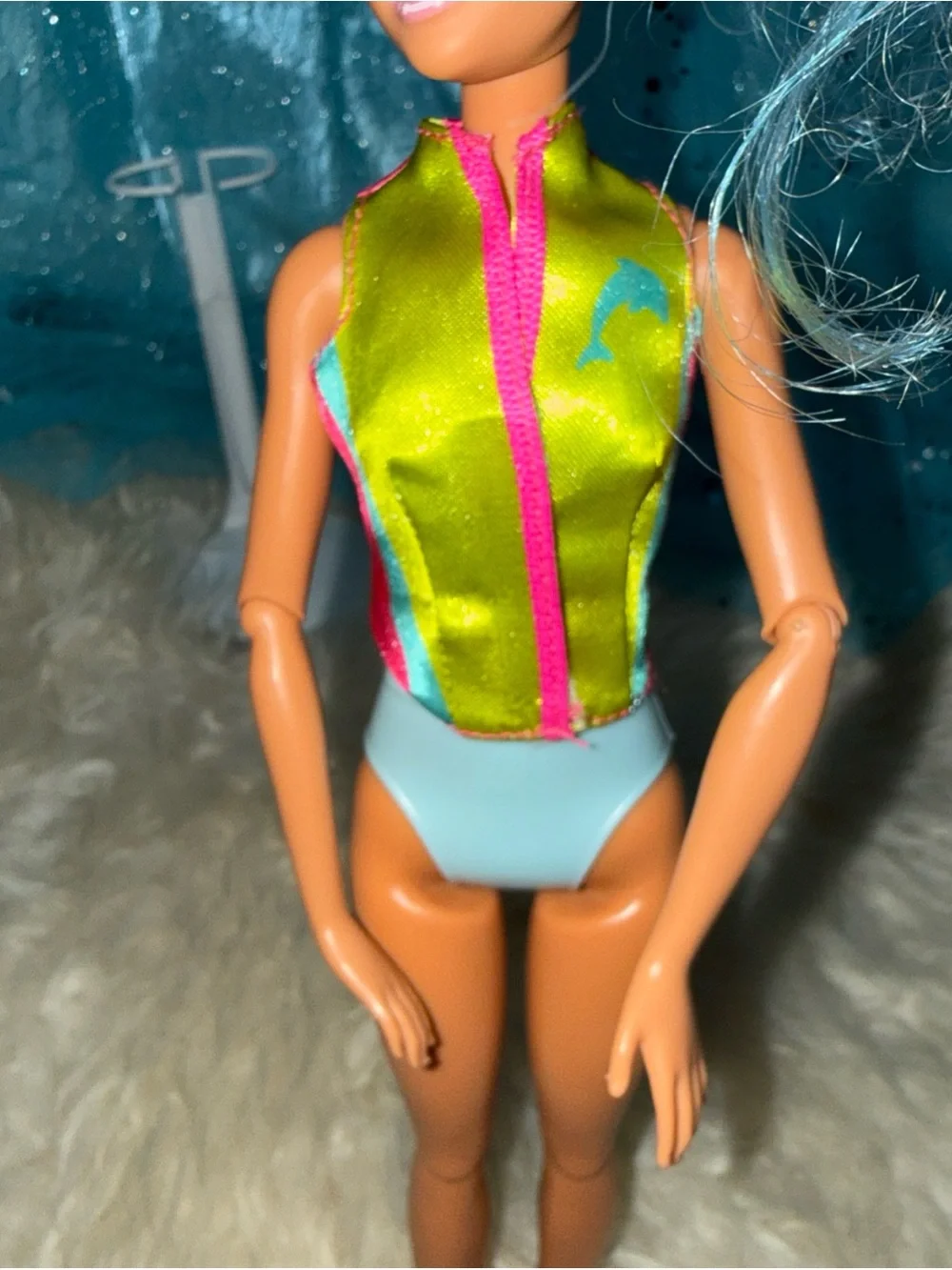 Barbie blue hair shaved head in life jacket top